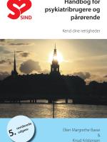 Christiansborg med solnedgang i baggrunden. Forside på 5. udgave af psykiatrihåndbogen.