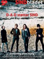 De fire medlemmer af Rockbandet D-A-D poserer foran en hvid skrænt